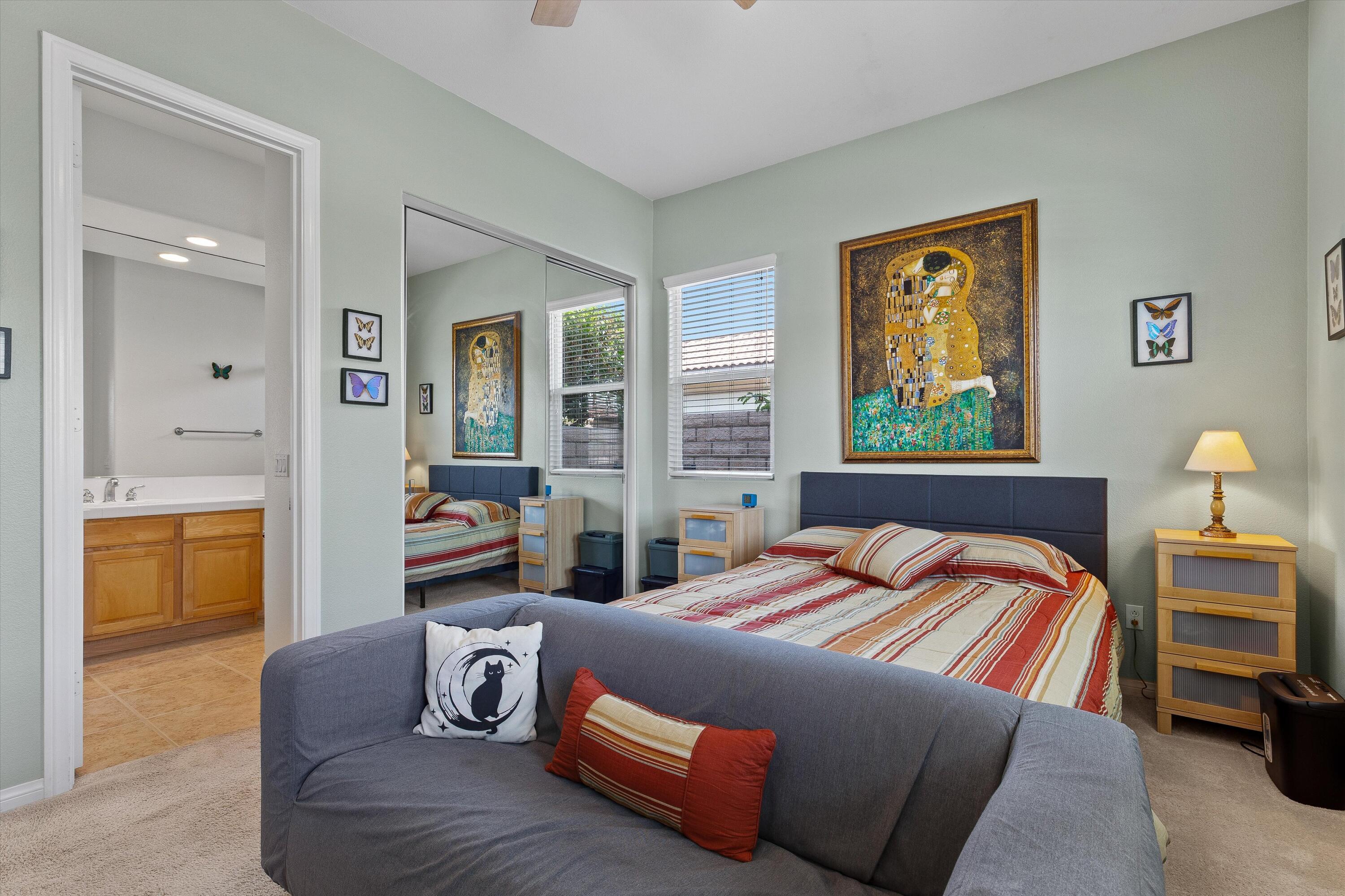 27 Via Del Maricale Rancho Mirage, CA 92270 - Photo 19 of 52 a bedroom with a bed and wooden floor