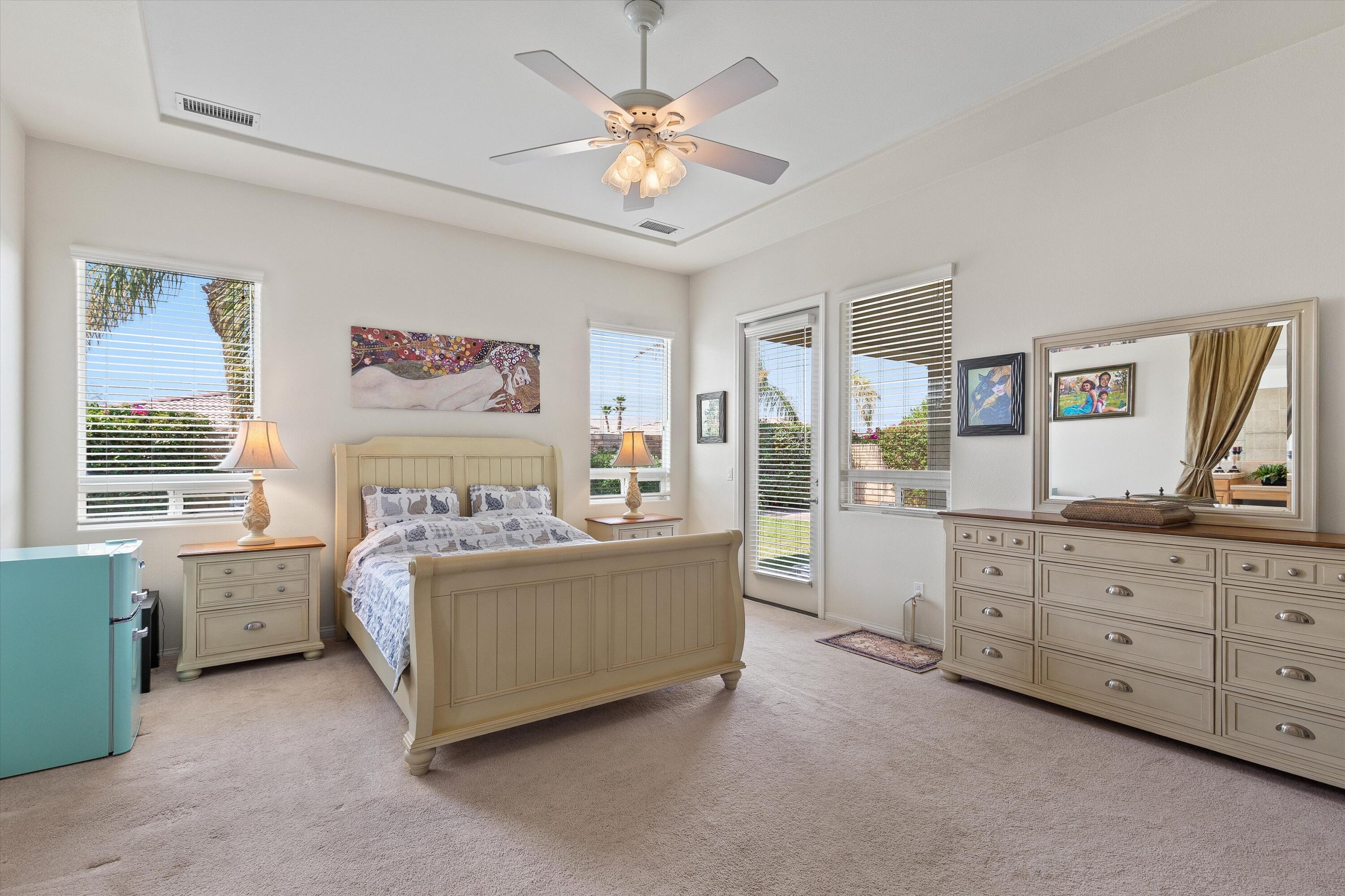 27 Via Del Maricale Rancho Mirage, CA 92270 - Photo 24 of 52 a bed room with a bed and a window