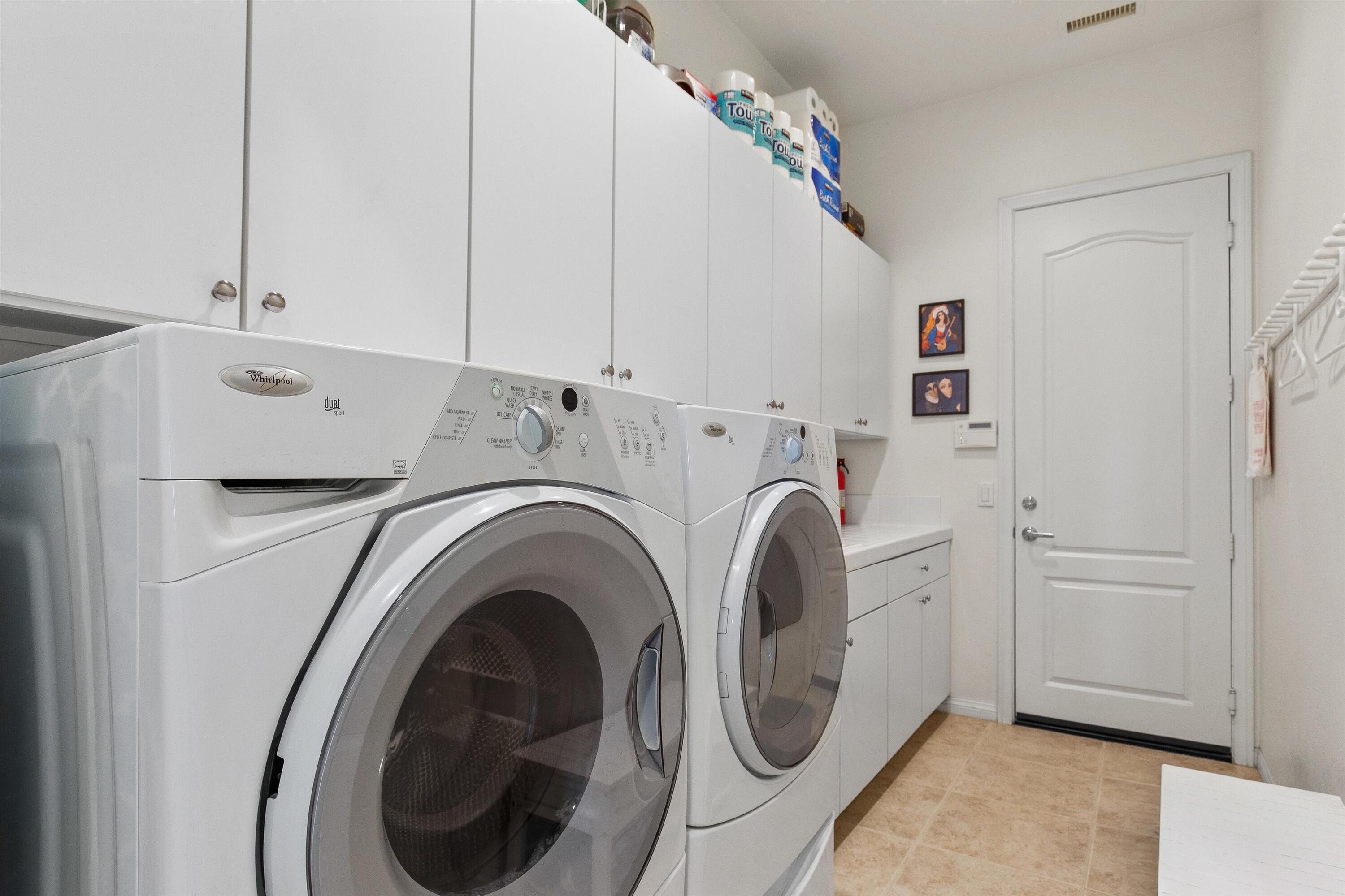 27 Via Del Maricale Rancho Mirage, CA 92270 - Photo 28 of 52 a utility room with dryer and washer