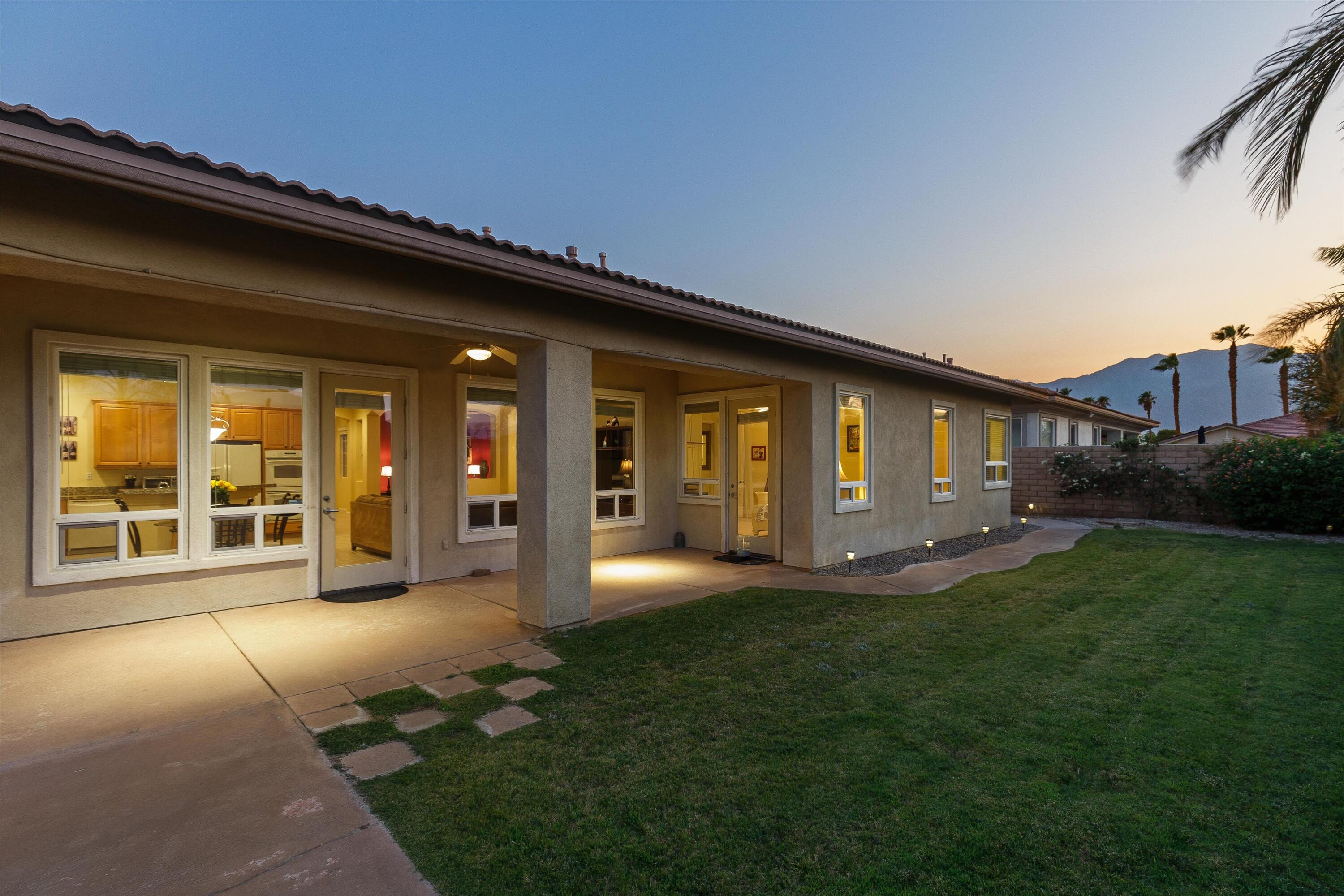 27 Via Del Maricale Rancho Mirage, CA 92270 - Photo 30 of 52 a view of a house with backyard and porch