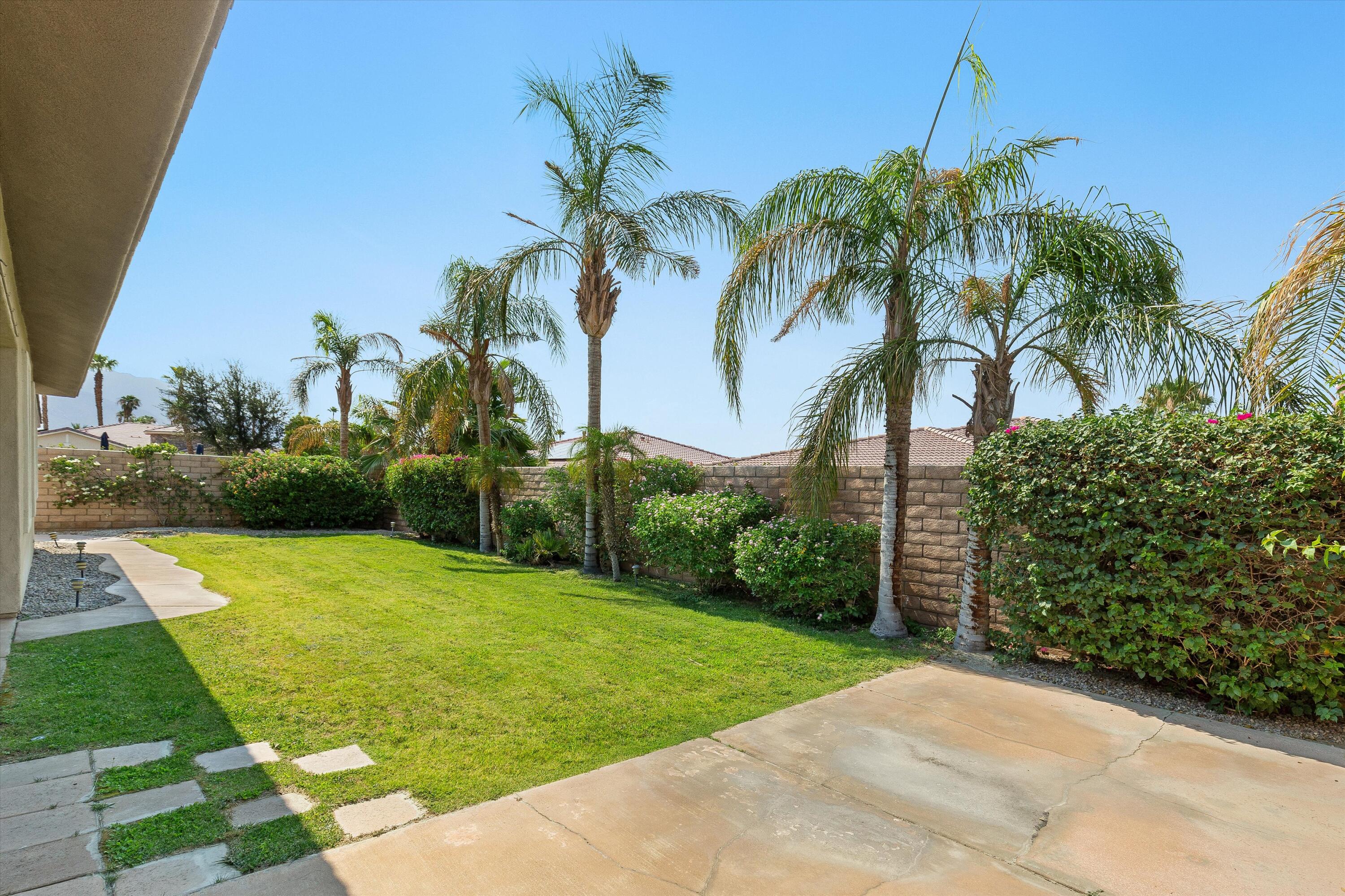 27 Via Del Maricale Rancho Mirage, CA 92270 - Photo 31 of 52 a view of a backyard with palm trees
