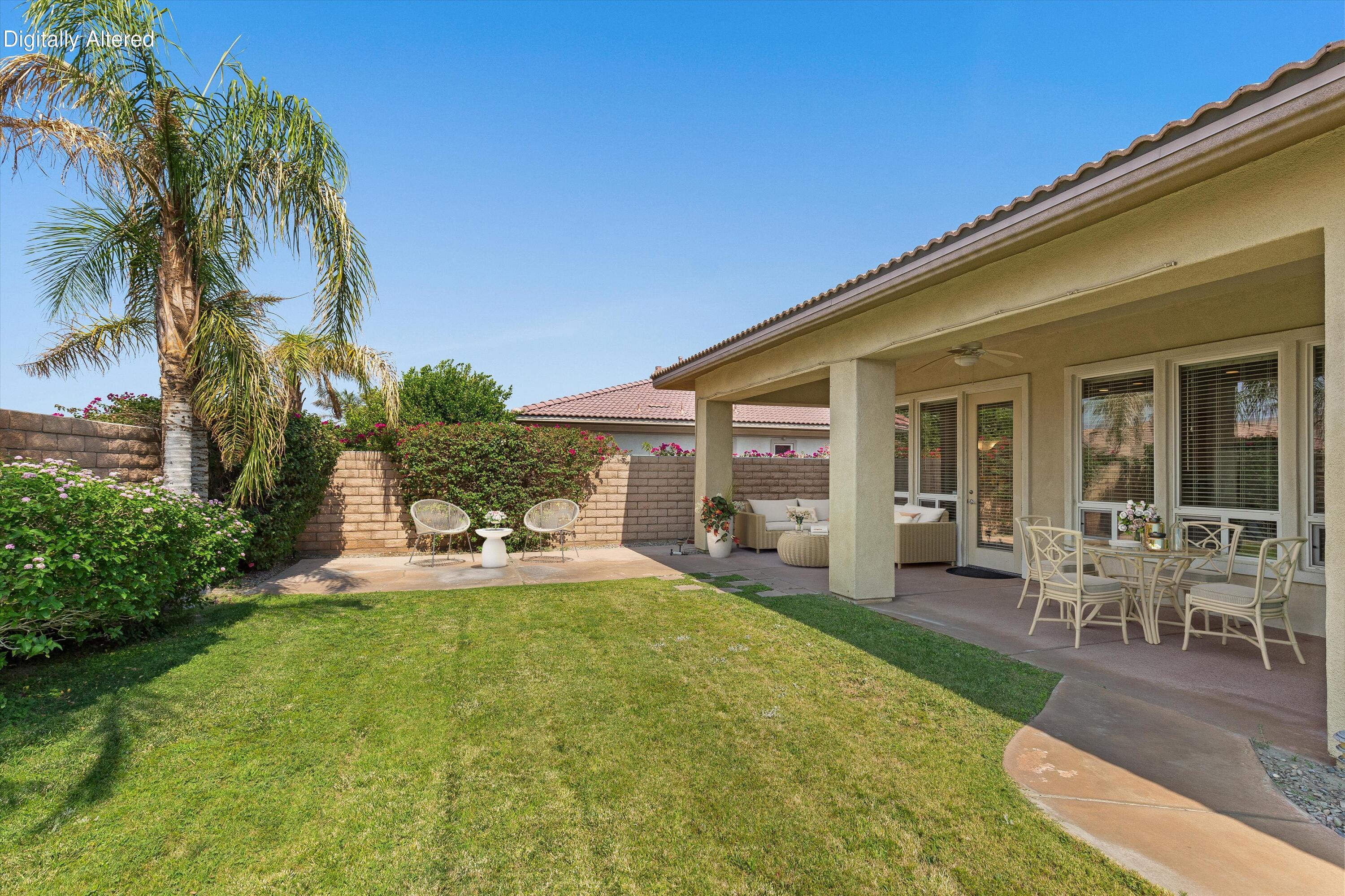 27 Via Del Maricale Rancho Mirage, CA 92270 - Photo 34 of 52 a view of a house with swimming pool and sitting area