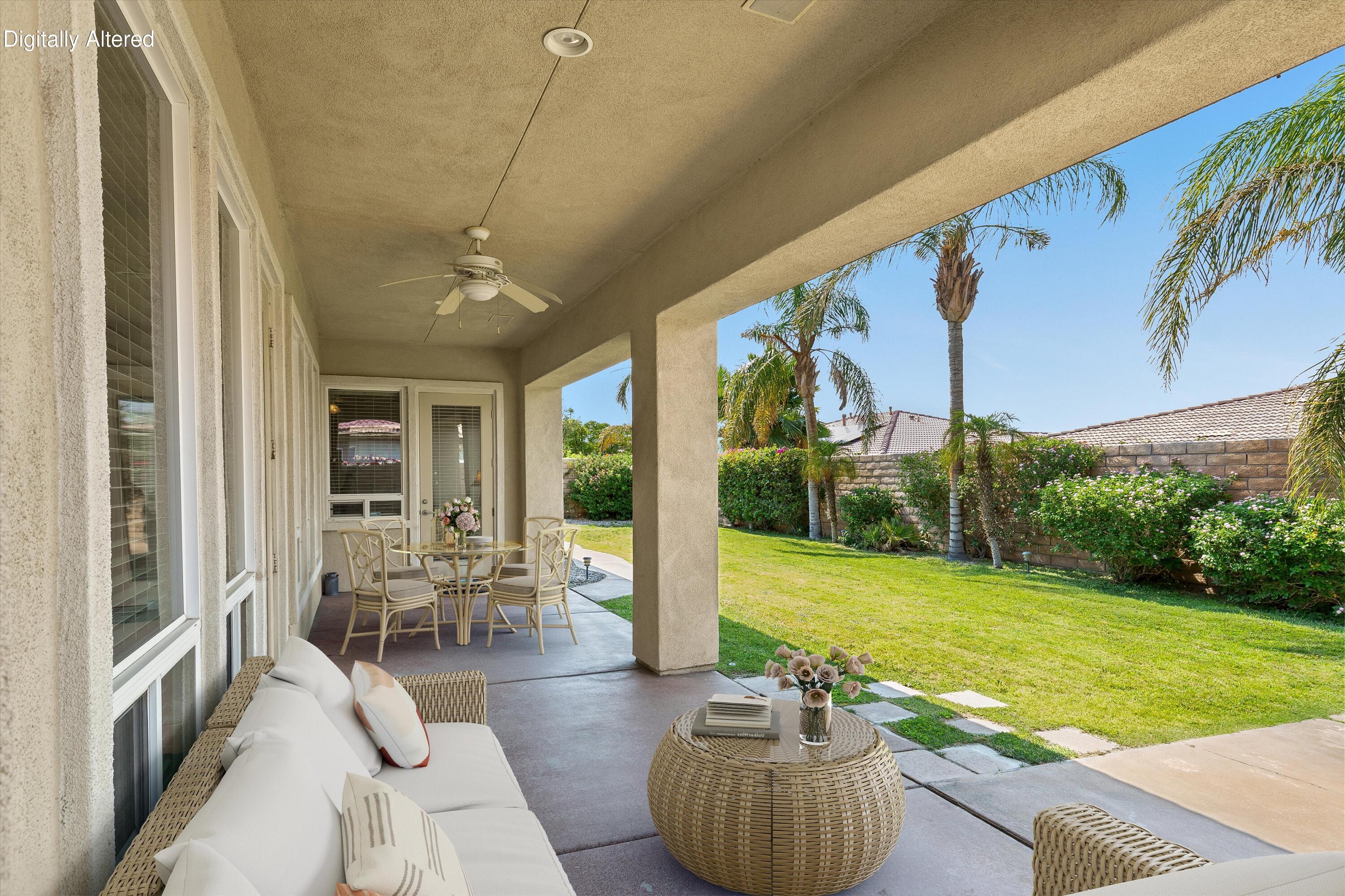 27 Via Del Maricale Rancho Mirage, CA 92270 - Photo 36 of 52 a living room with furniture and garden view