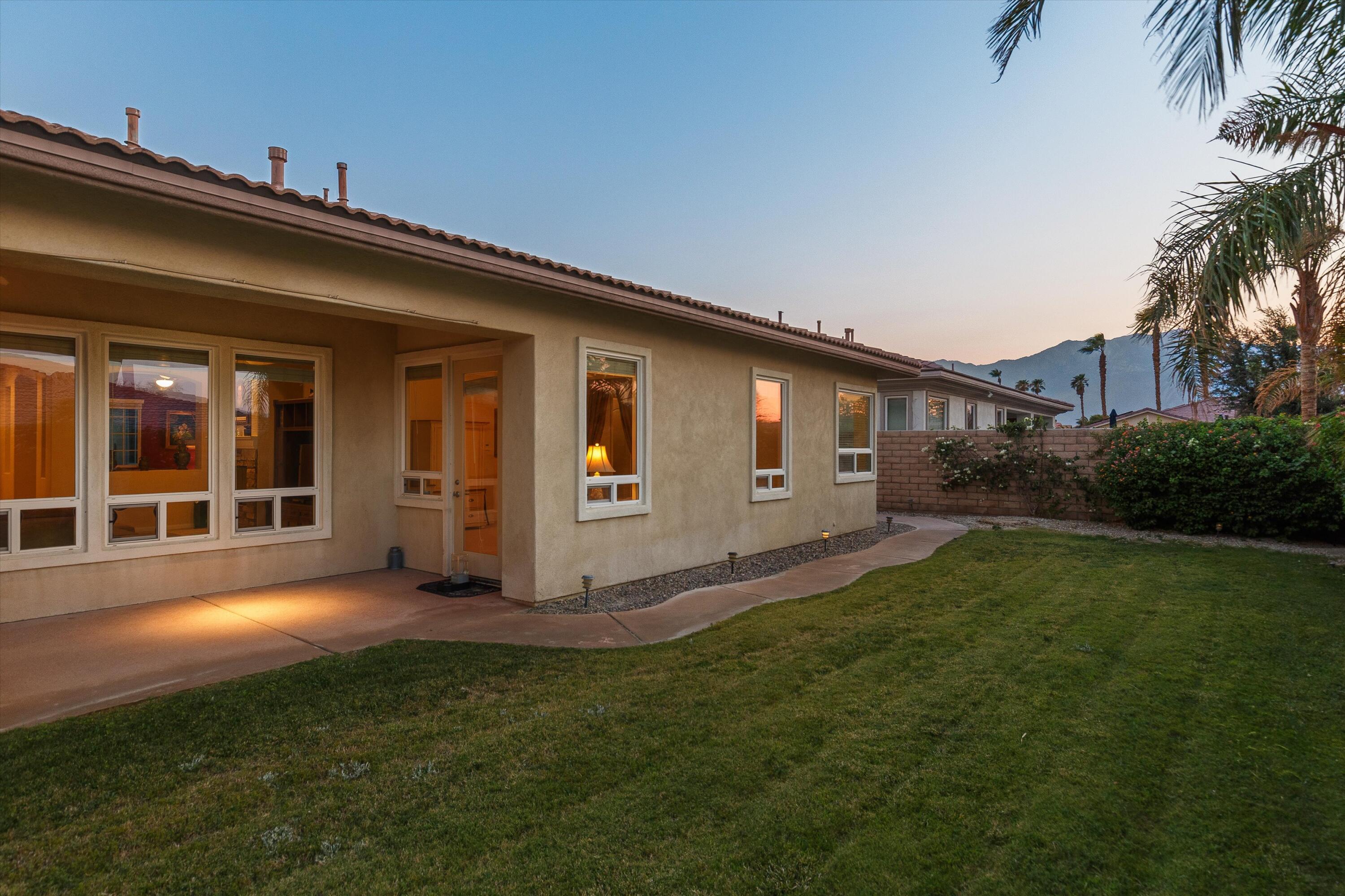 27 Via Del Maricale Rancho Mirage, CA 92270 - Photo 40 of 52 a view of a house with backyard and garden