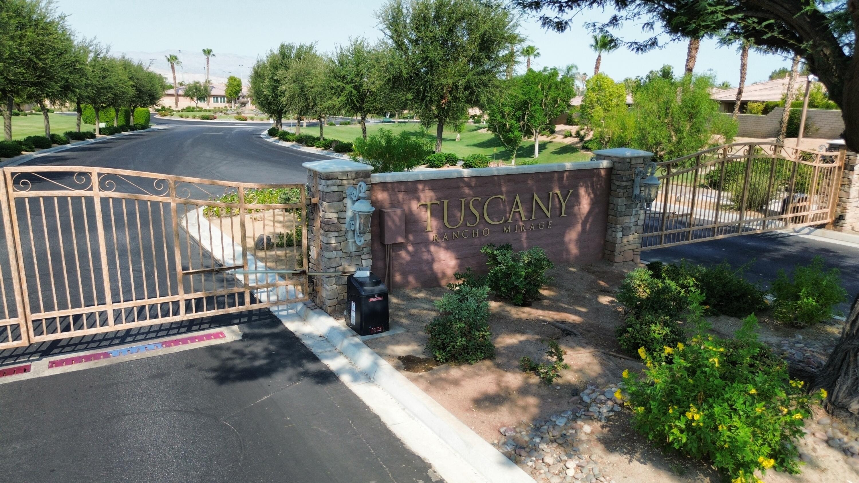 27 Via Del Maricale Rancho Mirage, CA 92270 - Photo 51 of 52 a view of a street with a small yard and large trees