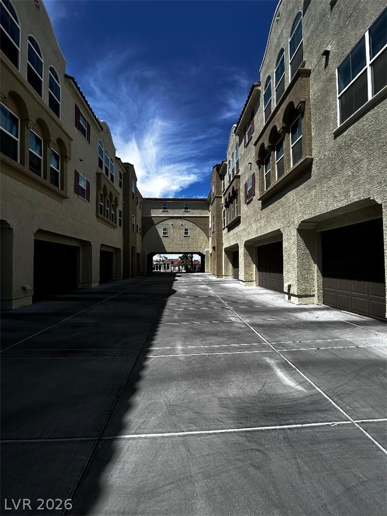 2555 Hampton Road, Unit 8206 Henderson, NV 89052 - Photo 28 of 35 This residential complex features modern architecture with attached garages and a unique sky bridge.