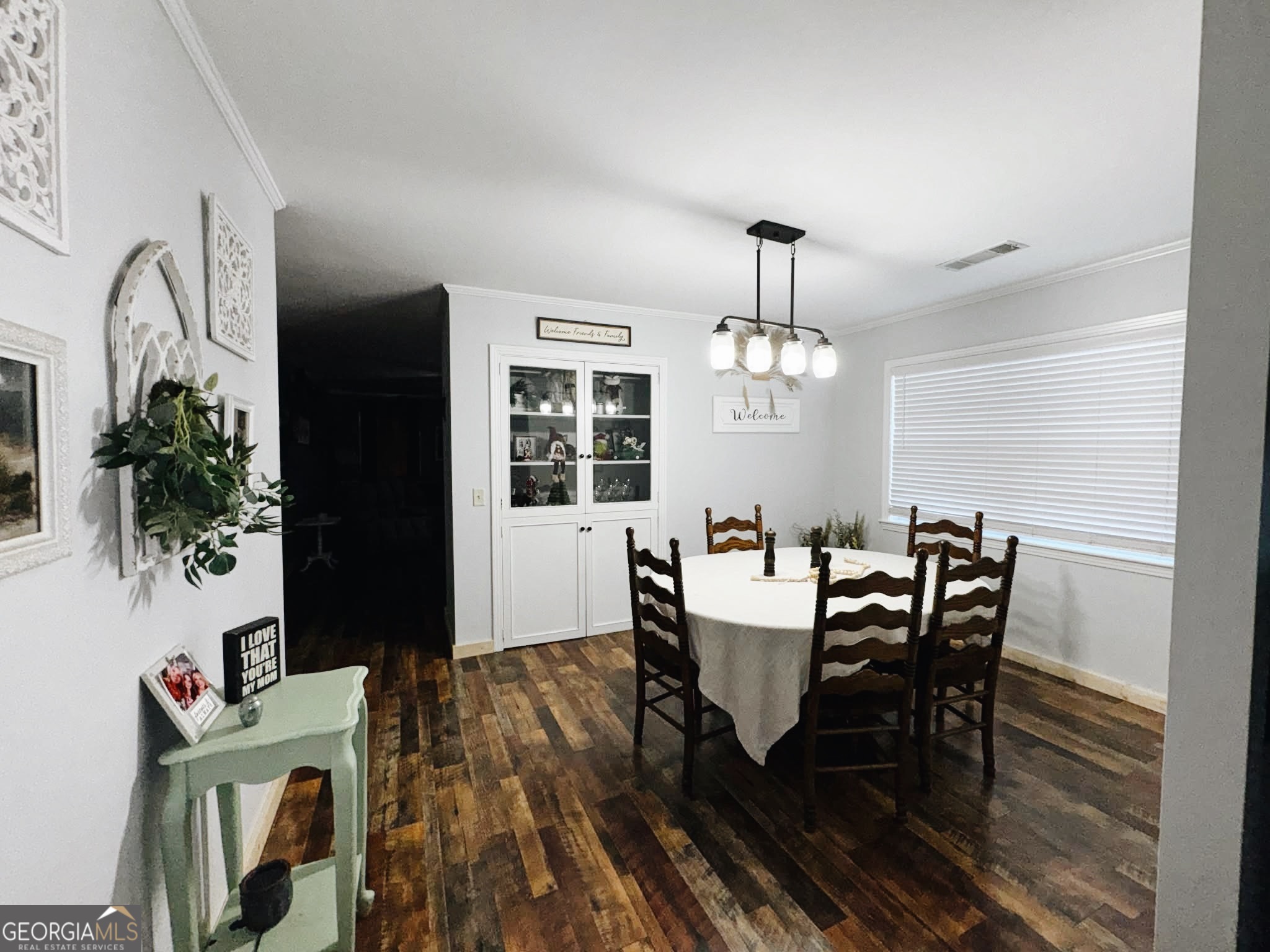 406 West 3rd Street Vidalia, GA 30474 - Photo 3 of 10 a view of a dining room with furniture window and wooden floor