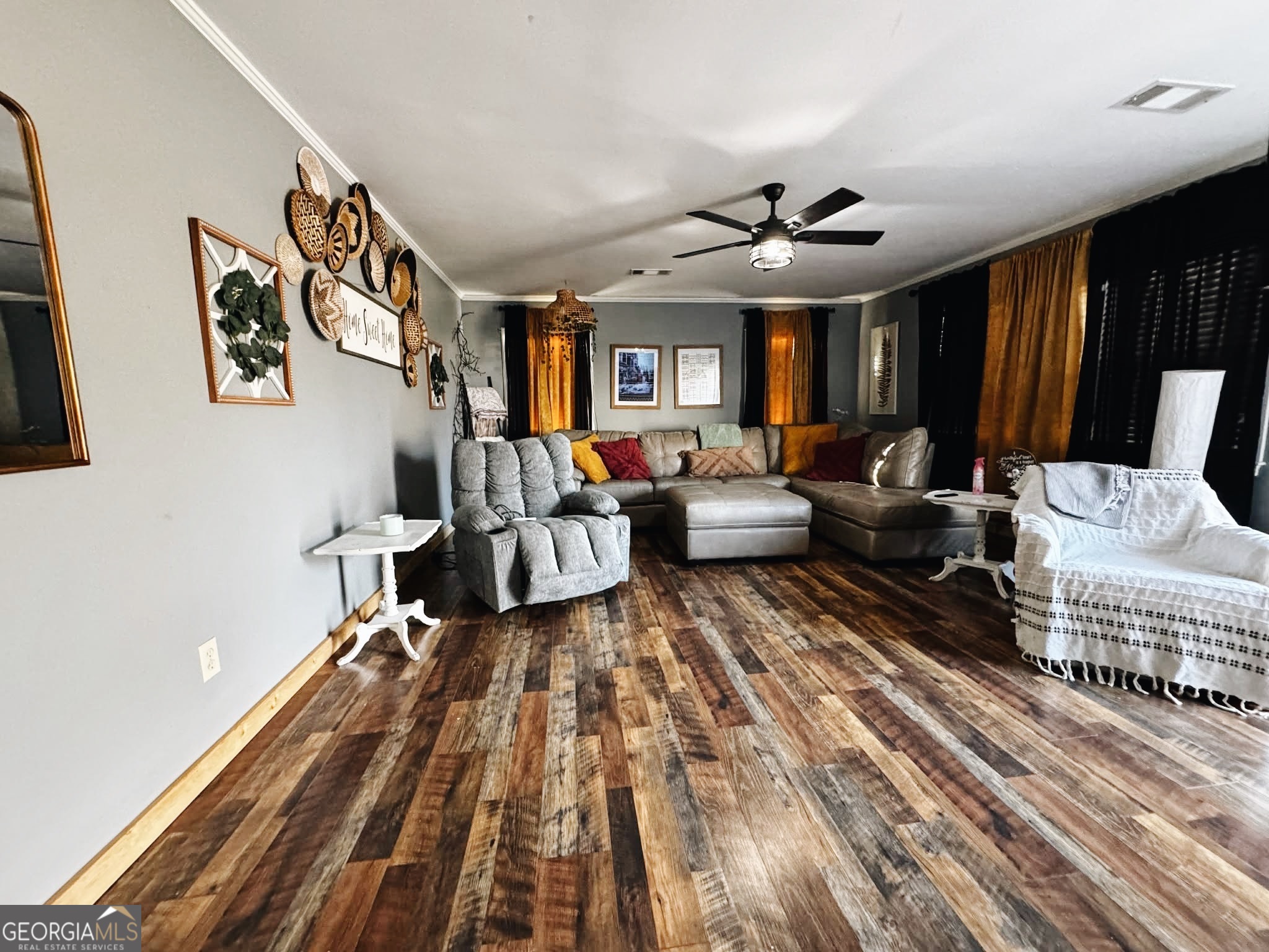 406 West 3rd Street Vidalia, GA 30474 - Photo 7 of 10 a living room with furniture and a large window