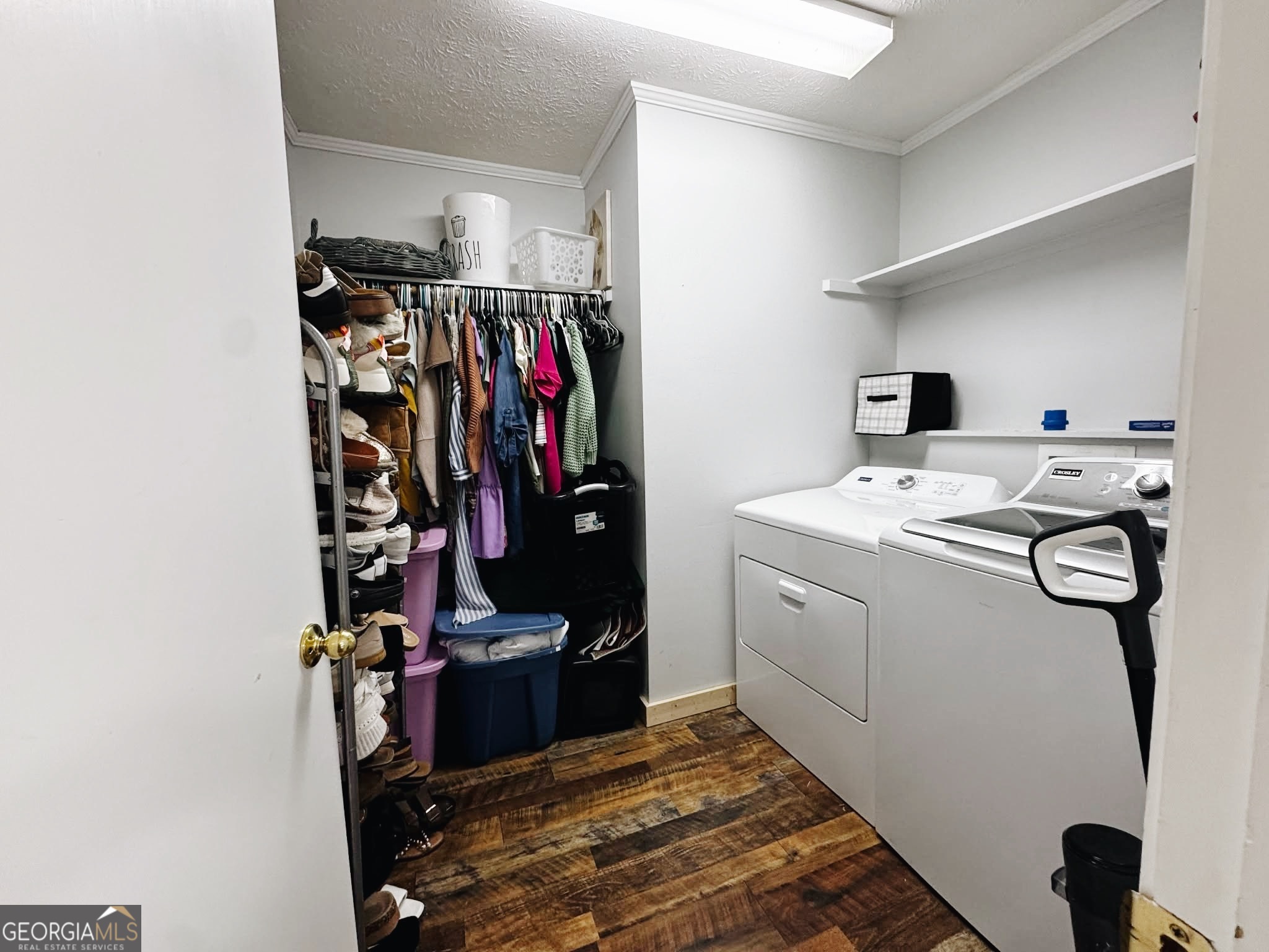 406 West 3rd Street Vidalia, GA 30474 - Photo 8 of 10 a view of a storage and utility room with washer and dryer