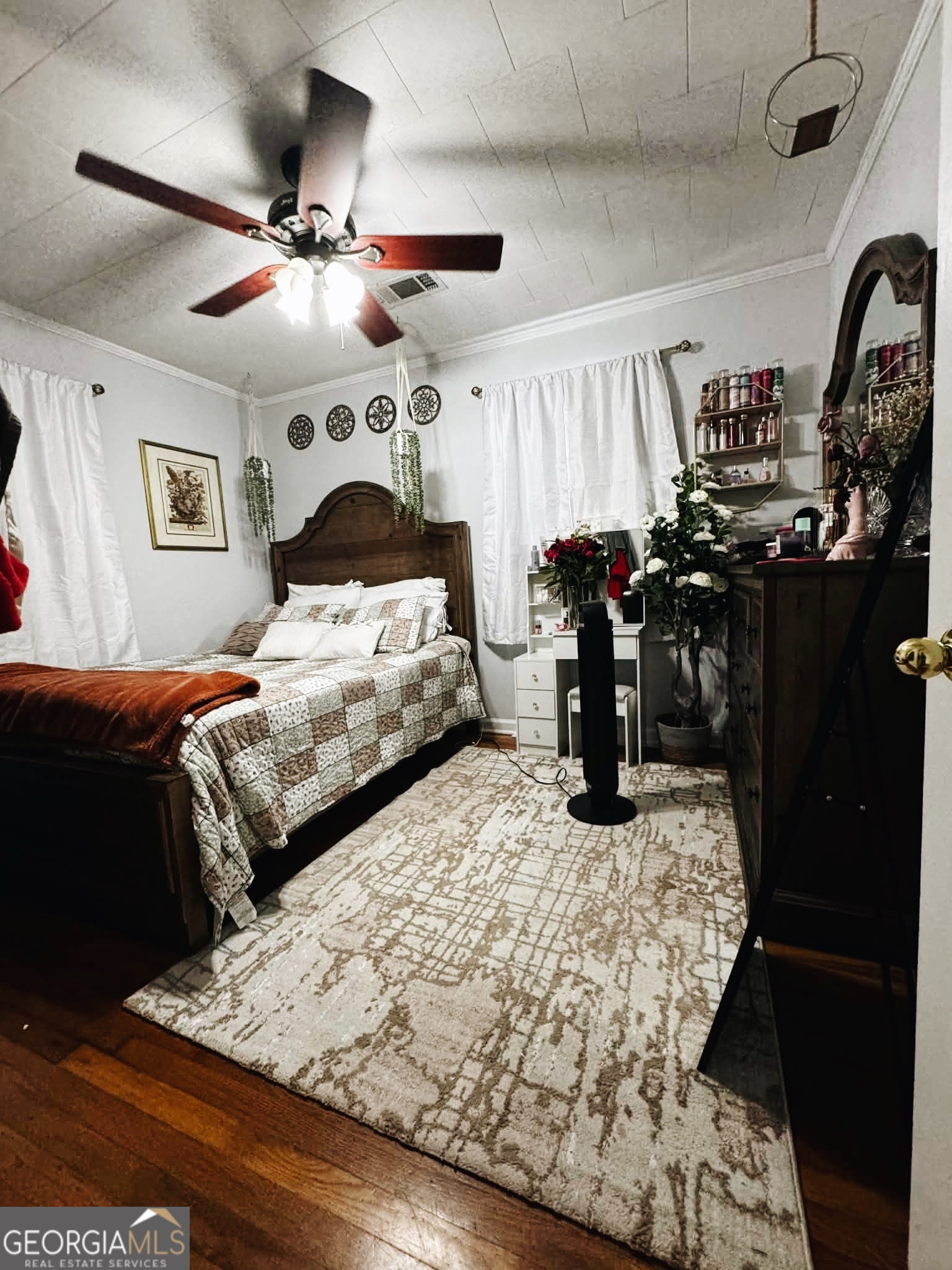 406 West 3rd Street Vidalia, GA 30474 - Photo 10 of 10 a bedroom with bed and wooden floor