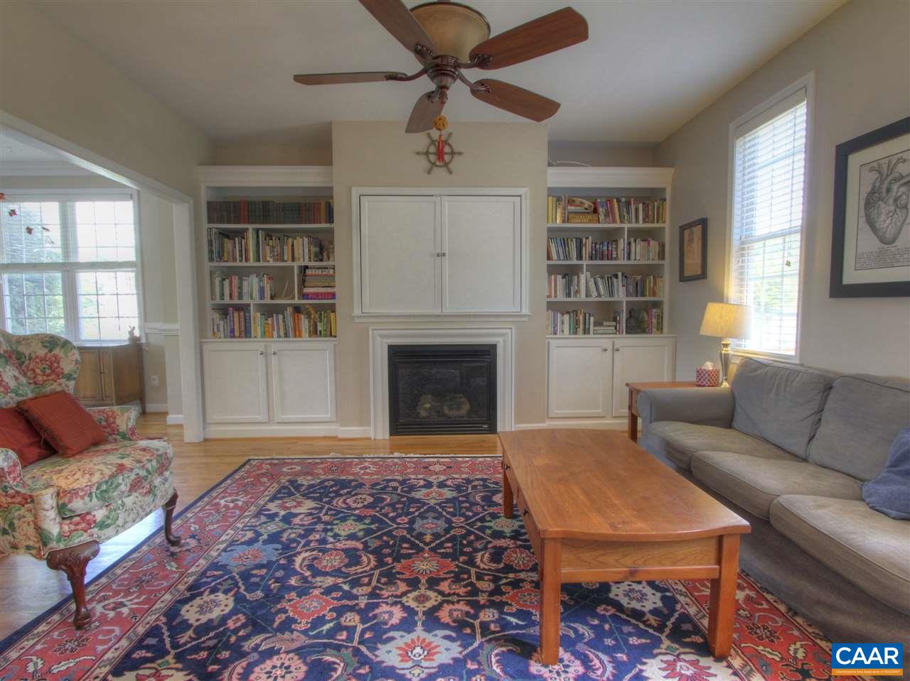 1275 Amber Ridge Road Charlottesville, VA 22901 - Photo 5 of 28 a living room with furniture and a fireplace