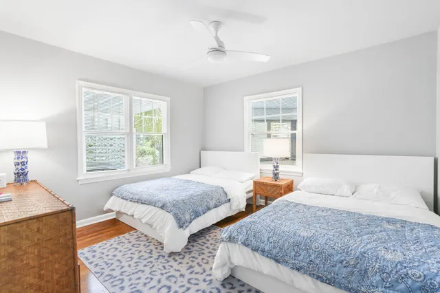 a bedroom with two beds and a window