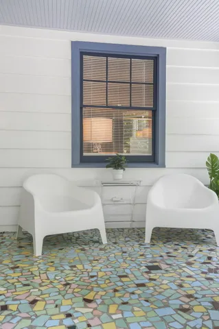 a bathroom with a bathtub and window