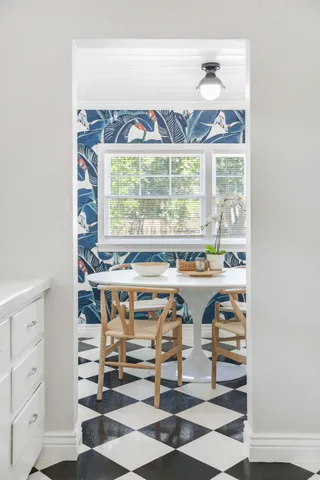 a bathroom with a sink a toilet and shower curtain