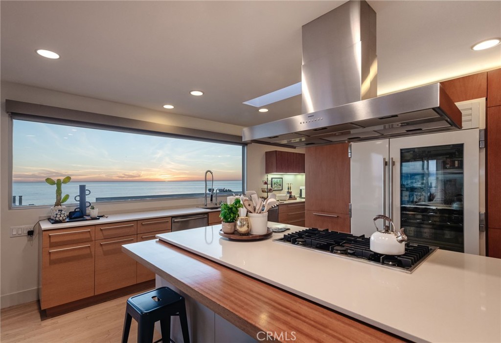 121 16th Street Manhattan Beach, CA 90266 - Photo 13 of 39 a kitchen with a sink and a refrigerator