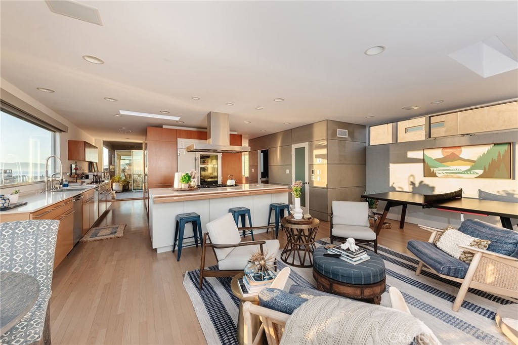 121 16th Street Manhattan Beach, CA 90266 - Photo 15 of 39 a living room with stainless steel appliances furniture and a kitchen view