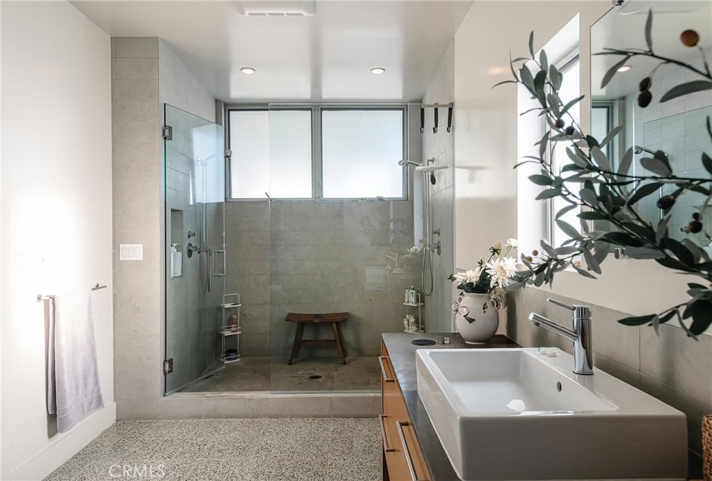 121 16th Street Manhattan Beach, CA 90266 - Photo 21 of 39 a bathroom with a sink a toilet and shower