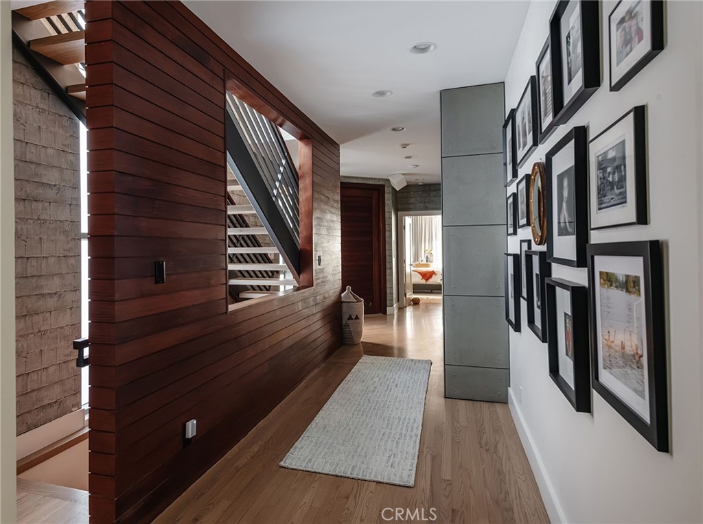 121 16th Street Manhattan Beach, CA 90266 - Photo 28 of 39 a view of hallway with stairs and wooden floor