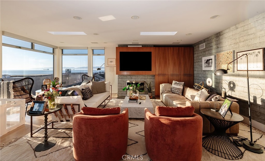 121 16th Street Manhattan Beach, CA 90266 - Photo 4 of 39 a living room with furniture kitchen view and a large window
