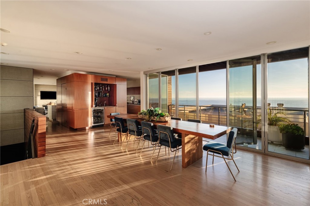 121 16th Street Manhattan Beach, CA 90266 - Photo 5 of 39 a dining room with furniture window and wooden floor