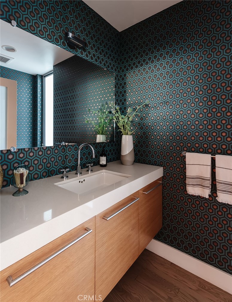 121 16th Street Manhattan Beach, CA 90266 - Photo 9 of 39 a bathroom with a sink and a mirror