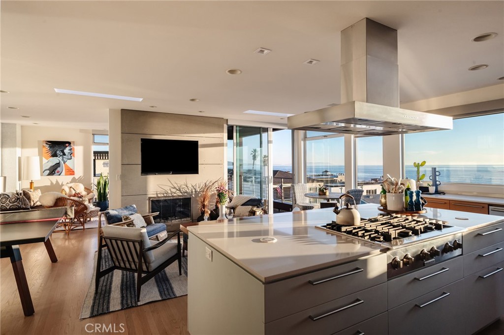 121 16th Street Manhattan Beach, CA 90266 - Photo 10 of 39 a kitchen with a stove and a view of living room