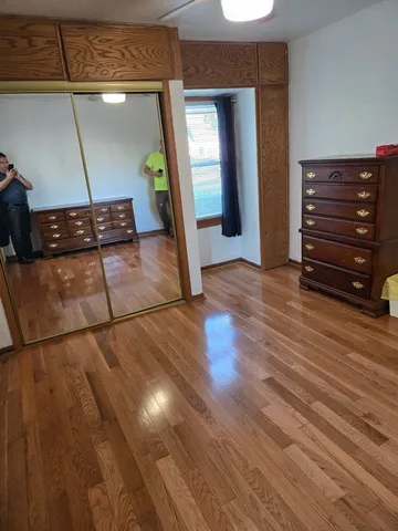 a view of a livingroom with wooden floor