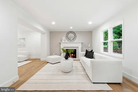 a bedroom with furniture and a fireplace