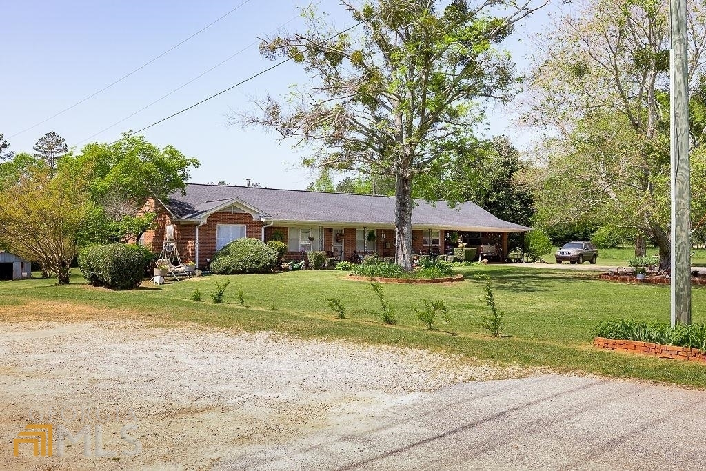 5371 Maysville Road Commerce, GA 30529 - Photo 1 of 1 a front view of a house with a yard