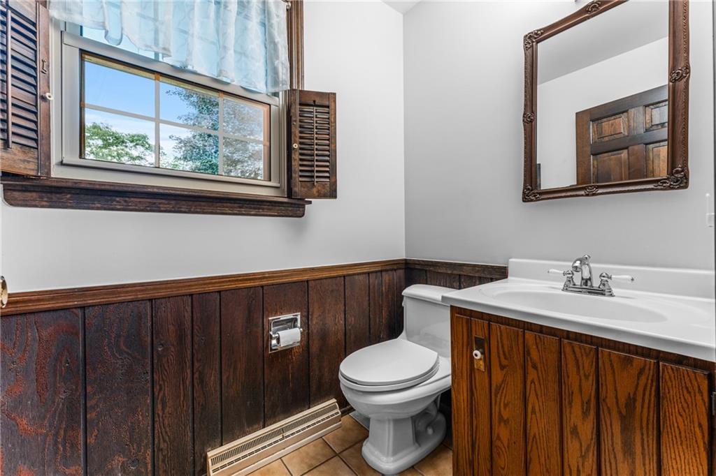171 East Airport Road Butler, PA 16002 - Photo 18 of 47 a bathroom with a toilet a sink and a mirror