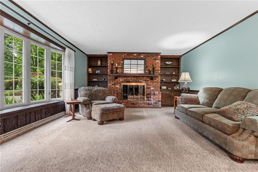 171 East Airport Road Butler, PA 16002 - Photo 20 of 47 a living room with furniture and a fireplace