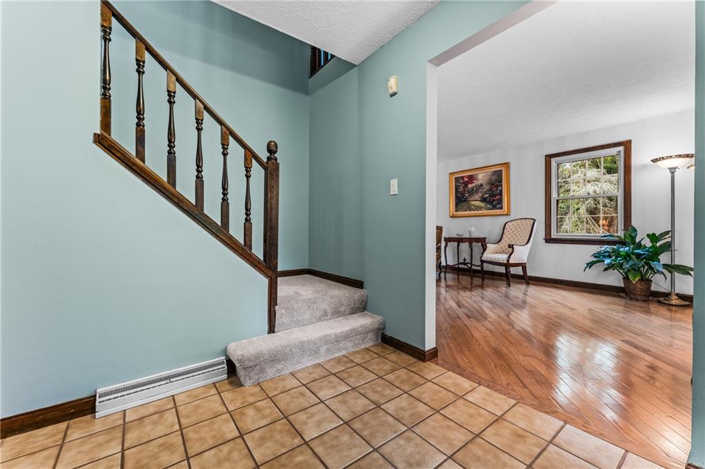 171 East Airport Road Butler, PA 16002 - Photo 22 of 47 a view of livingroom with furniture and stairs
