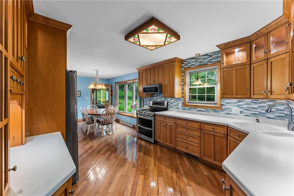 171 East Airport Road Butler, PA 16002 - Photo 23 of 47 a kitchen with sink cabinets and wooden floor