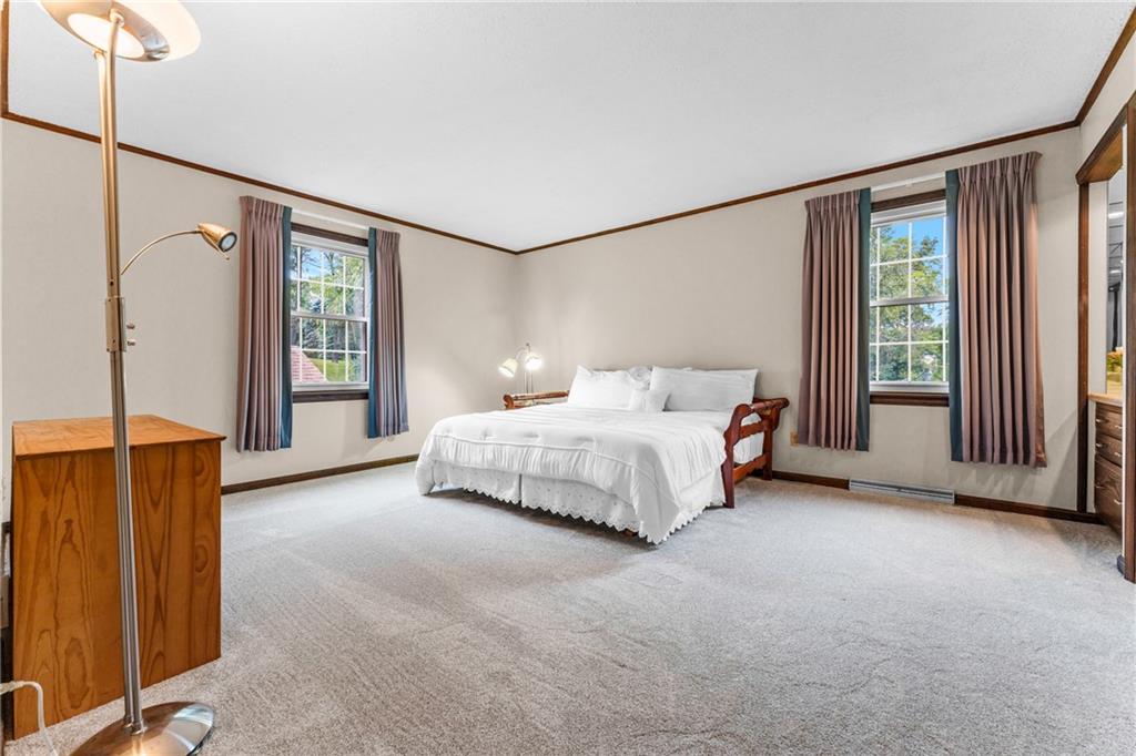171 East Airport Road Butler, PA 16002 - Photo 31 of 47 a bedroom with a bed lamps and a large mirror