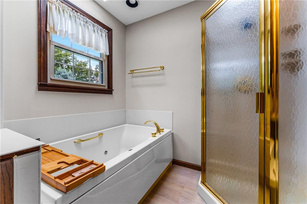 171 East Airport Road Butler, PA 16002 - Photo 35 of 47 a bathroom with a bathtub and a window