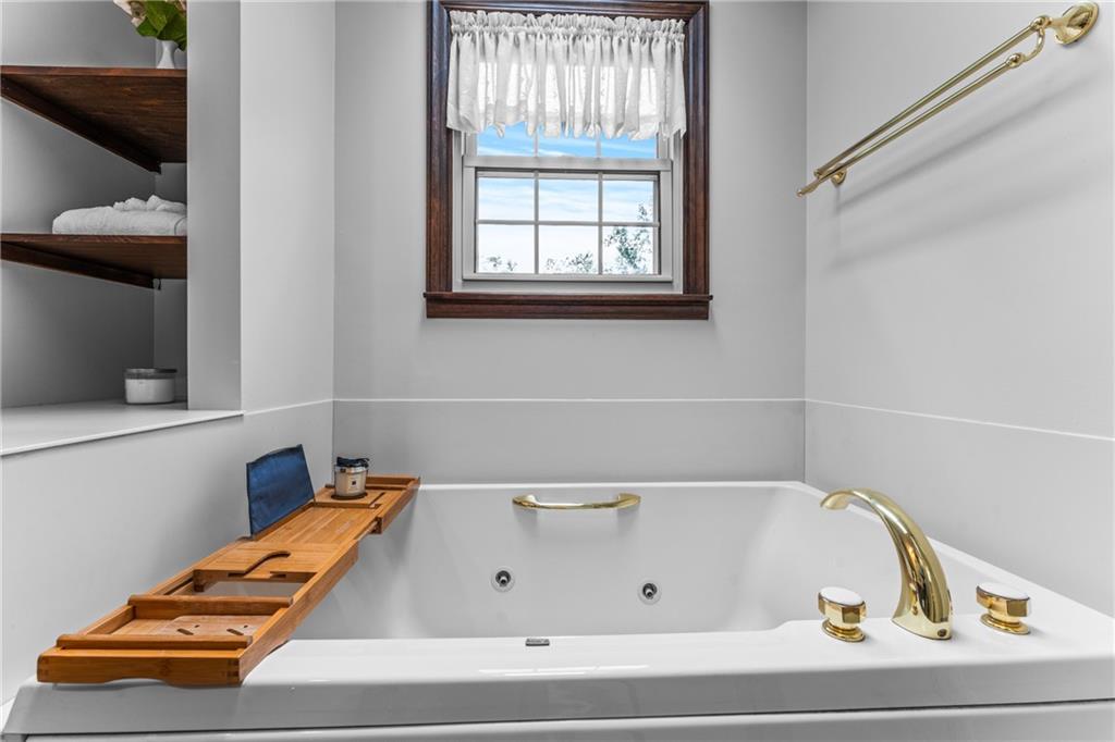 171 East Airport Road Butler, PA 16002 - Photo 36 of 47 a bathroom with a tub and a window