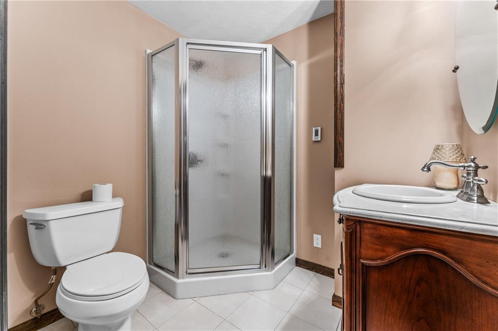 171 East Airport Road Butler, PA 16002 - Photo 45 of 47 a bathroom with a granite countertop toilet sink and shower
