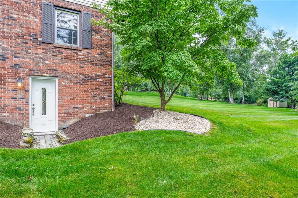 171 East Airport Road Butler, PA 16002 - Photo 8 of 47 a view of a brick house with a yard