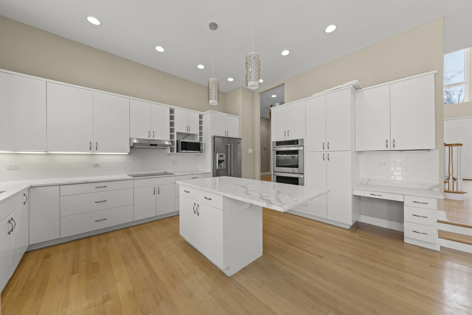 1663 Pebble Beach Way Vernon Hills, IL 60061 - Photo 12 of 40 a large kitchen with cabinets and wooden floor