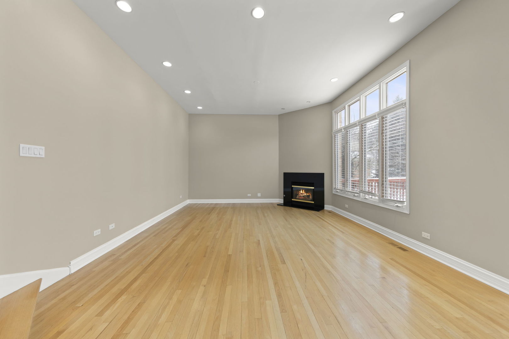 1663 Pebble Beach Way Vernon Hills, IL 60061 - Photo 14 of 40 a view of an empty room with wooden floor and a window