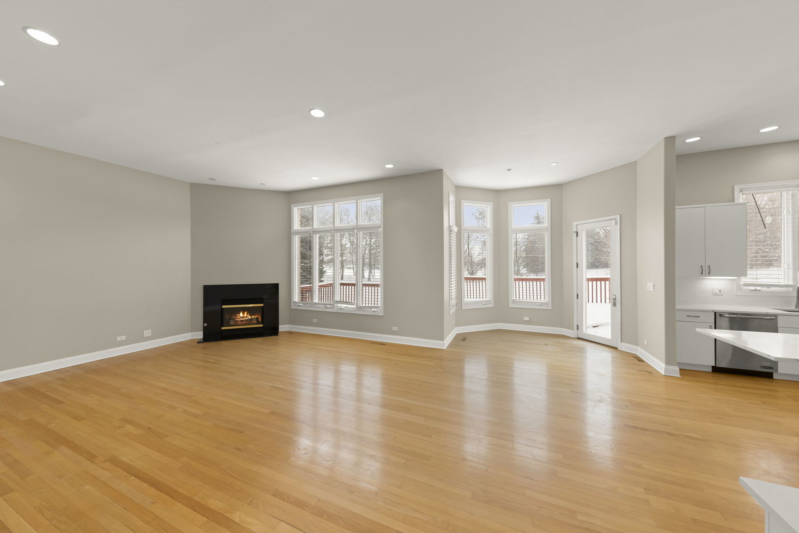 1663 Pebble Beach Way Vernon Hills, IL 60061 - Photo 8 of 40 a view of an empty room with window and wooden floor