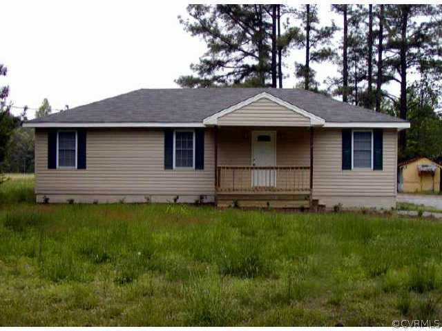 14726 Halifax Road Carson, VA 23830 - Photo 1 of 1 a front view of a house with a yard