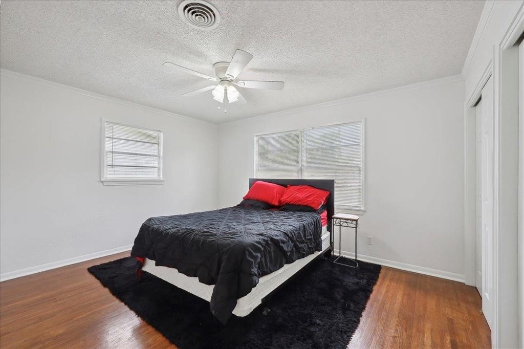 253 Hampton Lane Beaumont, TX 77707 - Photo 18 of 33 a bedroom with a bed and a window