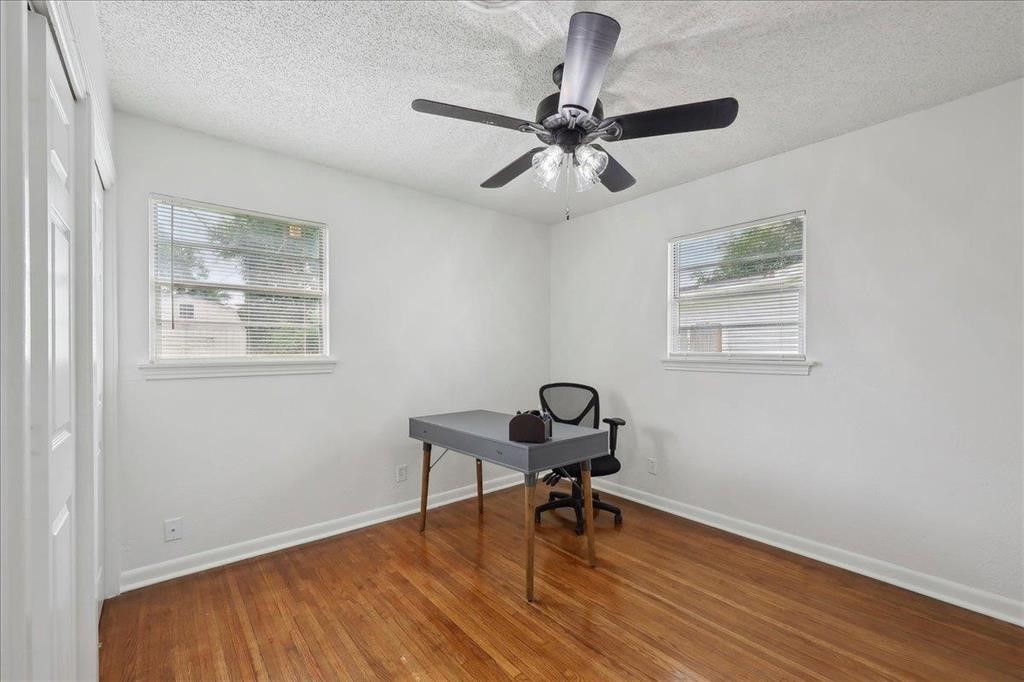 253 Hampton Lane Beaumont, TX 77707 - Photo 20 of 33 a view of a workspace with wooden floor and a window