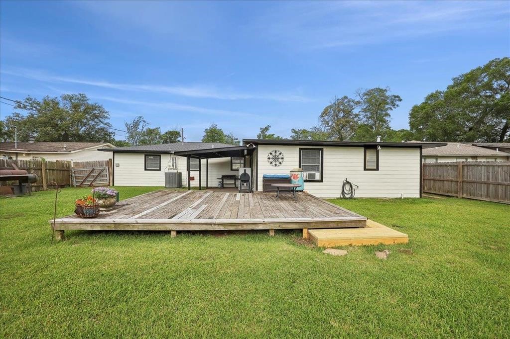 253 Hampton Lane Beaumont, TX 77707 - Photo 26 of 33 a view of a house with a backyard patio and swimming pool