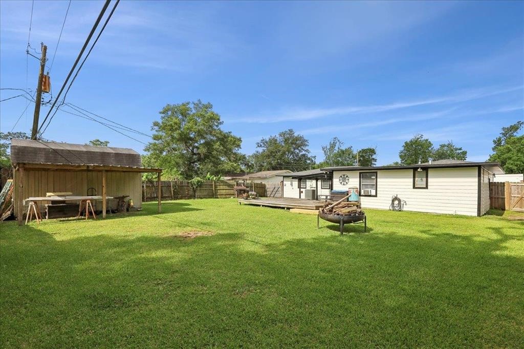 253 Hampton Lane Beaumont, TX 77707 - Photo 28 of 33 a view of a house with backyard and porch