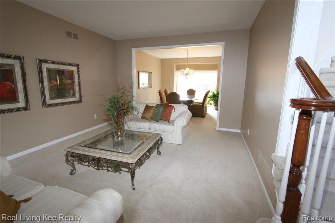 3495 Heron Ridge Drive Rochester, MI 48309 - Photo 5 of 49 TO THE LEFT-THE SPACIOUS LIVING ROOM