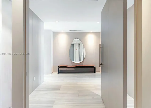 a bathroom with a mirror and a shower