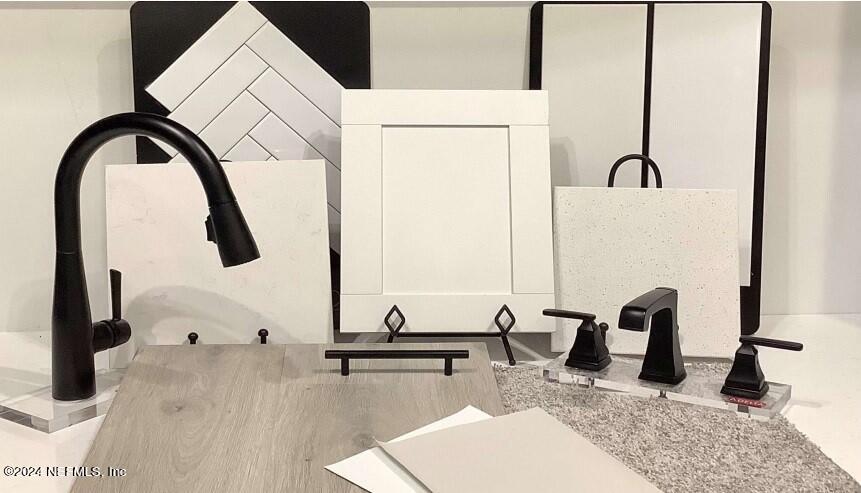 619 Bartram Downs Road Orange Park, FL 32065 - Photo 3 of 6 a bathroom with a sink and a mirror