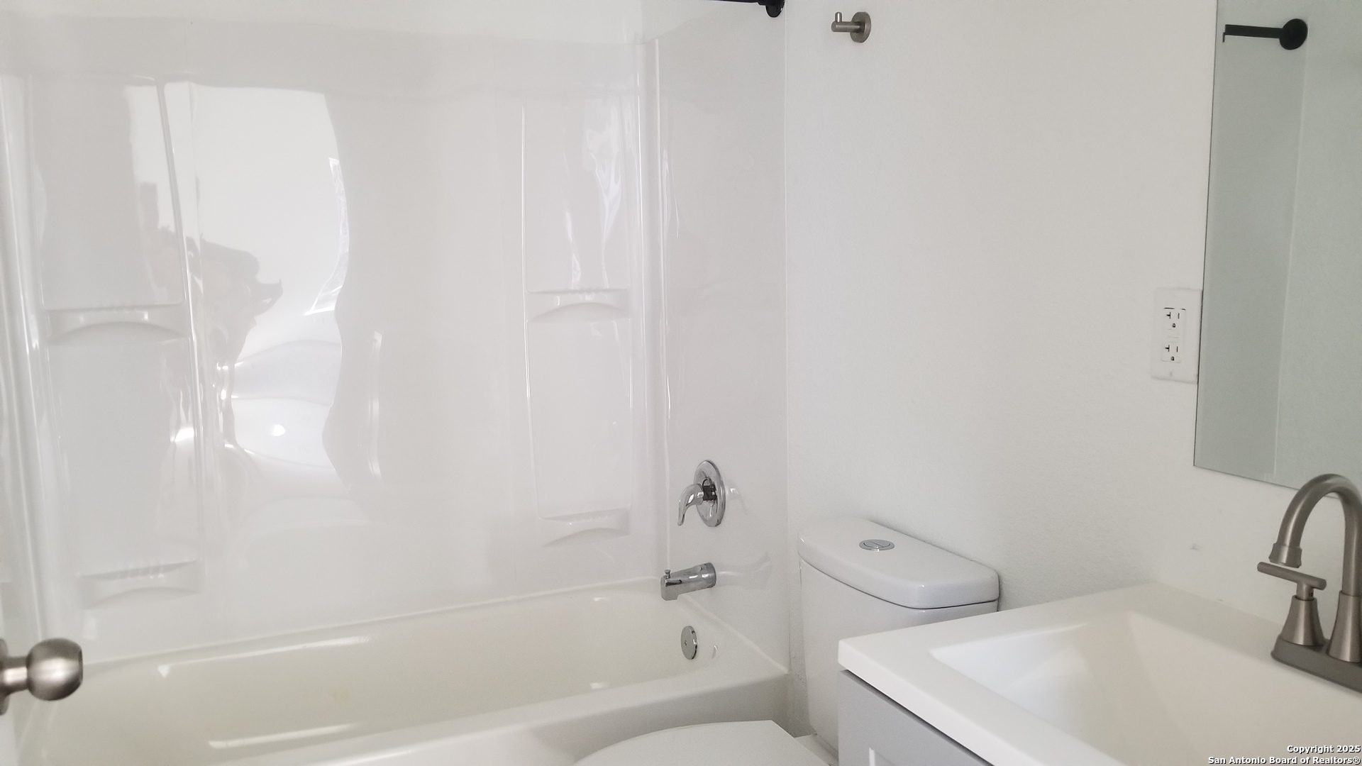1063 Sleepy Spring Branch, TX 78070 - Photo 11 of 14 a white bath tub sitting next to a white toilet